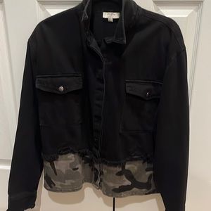 Denim jacket with camo bottom